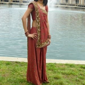 Maroon saree with gold polka-dots